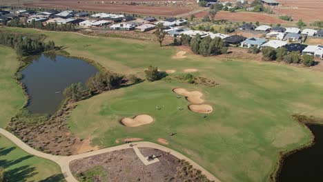 Yarrawonga,-Victoria,-Australia---18-April-2023:-Pull-back-over-a-green-as-golfers-are-preparing-to-putt-at-Black-Bull-Golf-Club-Yarrawonga