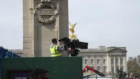 4-May-2023---Cameraman-Wearing-Hi-Vis-Checking-Live-TV-Broadcast-Camera-For-King-Charles-Coronation-At-The-Mall,-Buckingham-Palace