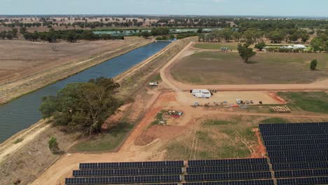 Mulwala,-New-South-Wales,-Australia---18-February-2023:-Aerial-of-works-area-and-solar-panels-of-ESCO-Pacific-Solar-Farm-Mulwala-New-South-Wales