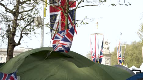 Union-Jack-Flag-And-Kings-Charles-Photo-In-Middle-Lining-Waving-From-Tent-Beside-The-Mall-For-Coronation-Ceremony