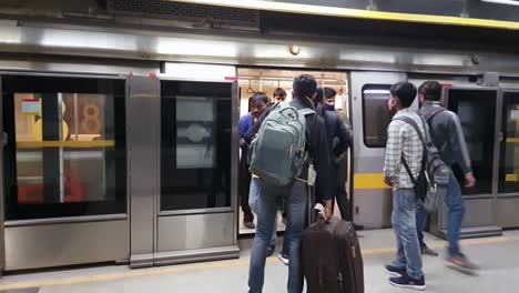 passenger-deboarding-and-boarding-at-metro-station-from-metro-train-arriving-video-is-taken-at-new-delhi-metro-station-new-delhi-india-on-Apr-10-2022