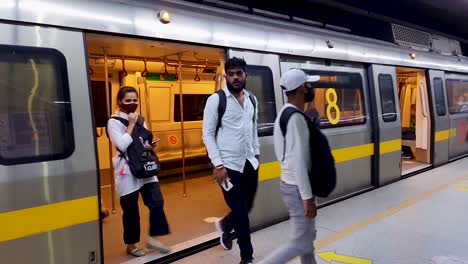passenger-deboarding-from-metro-train-at-station-at-morning-video-is-taken-at-vaishali-metro-station-new-delhi-india-on-Apr-10-2022