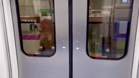 metro-train-arriving-at-station-with-automatic-gate-opening-to-deboarding-video-is-taken-at-new-delhi-metro-station-new-delhi-india-on-Apr-10-2022