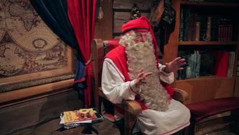 The-camera-moves-about-the-real-Santa-Claus-for-an-interview-at-his-home-at-Santa-Claus-Village,-to-which-he-recently-moved-from-the-North-Pole