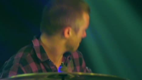 Close-up-face-of-drummer-during-concert