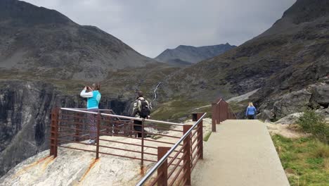 Old-people-enjoying-the-view-of-the-viewpoint-in-Trollstigen-and-taking-pictures-in-slow-motion
