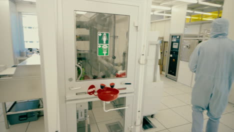 Rare-footage-from-inside-of-a-specialized-cleanroom-Laboratory-where-technology-is-developed-where-a-scientist-is-walking-through-nano-technology-cleanroom-facility