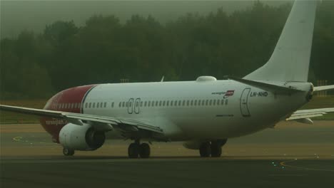 A-white-and-red-airplane-turning-left-and-are-taxiing-towards-the-runway-at-Stockholm-Arlanda