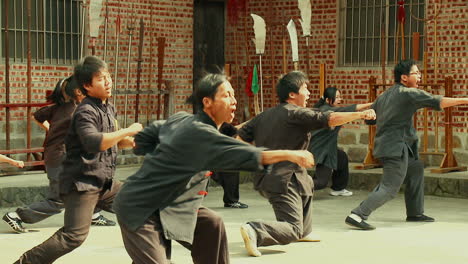 Wushu-Master-and-Disciples-Synchronized-Kungfu-at-Martial-Arts-School
