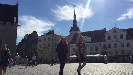 People-walking-in-downtown-city-center-in-Tallinn,-Estonia