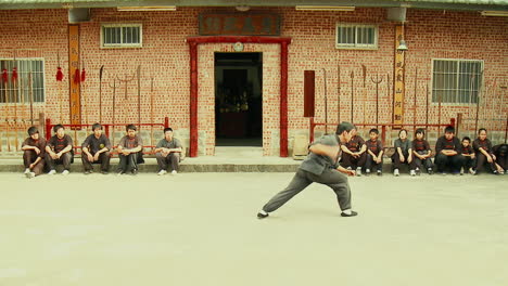 Skilled-Kung-Fu-fighter-practicing-in-Traditional-Martial-Arts-School