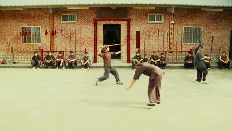 Asian-Girls-At-Martial-Arts-Fight-School-practicing-with-Wooden-Swords-Static