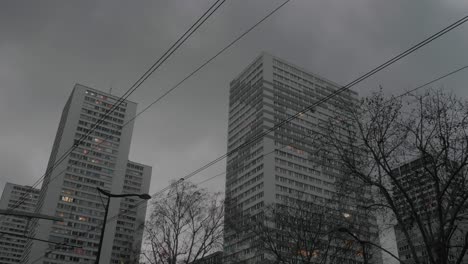 Apartment-Blocks-In-Paris-On-Cloudy-Day-Seen-Through-Tram-Lines