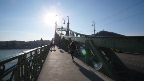 Walking-on-the-Liberty-Bridge-Or-Freedom-Bridge-in-Budapest,-Hungary