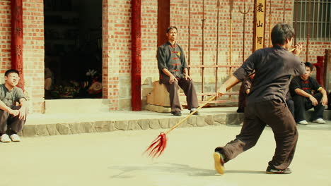 Tracking-Shot-Young-Kungfu-Master-practicing-with-Spear-at-Oriental-Fight-School