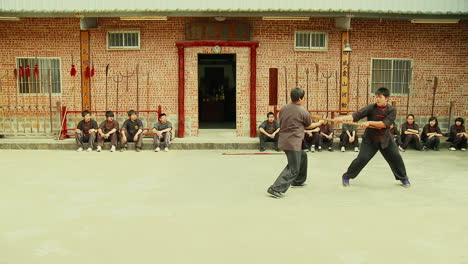 Sham-Fight-between-two-Martial-Arts-Fighters-in-Traditional-Setting