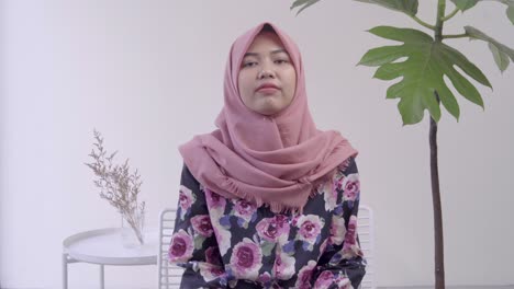Indonesian-girl-wearing-hijab-sitting-down-for-an-interview