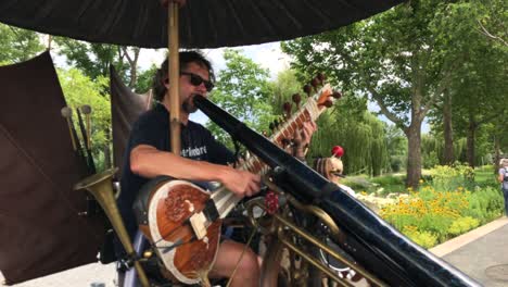 Multi-talented-musical-man-playing-instruments-at-state-garden-show-Heilbronn