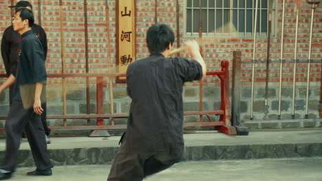 Oriental-Fighter-practicing-with-Martial-Arts-Staff