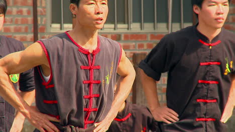 Chinese-martial-arts-master-with-his-pupils-in-a-demostration