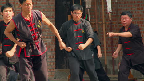 Practicing-martial-arts-in-an-old-temple-and-doing-movements-at-the-same-time