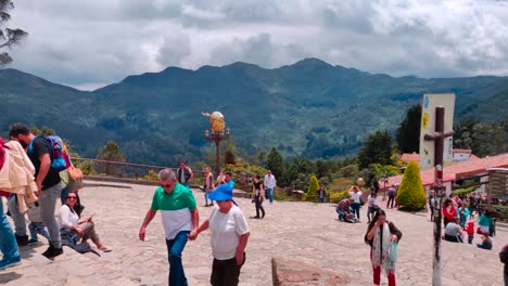 Tourists-and-local-people-walking,-taking-pictures-and-enjoying-the-top-of-the-Monserrate-cable-car-in-Bogotá,-Colombia
