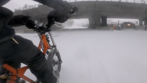 Side-Angle-POV-Of-Courier-On-Radburro-Riding-During-Heavy-Snow-In-Downtown-Montreal
