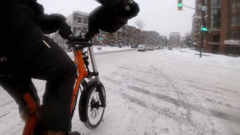 Timelapse-Side-Angle-POV-Of-Courier-On-E-Bike-Riding-Through-Winter-Roads-In-Downtown-Montreal