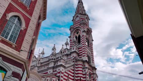 A-Cathedral-with-red-and-white-colors-and-stripes-on-the-old-town-of-Bogotá,-Colombia