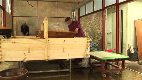 Worker-Dipping-Screen-and-Pressing-Paper-in-Traditional-Chinese-Paper-Mill