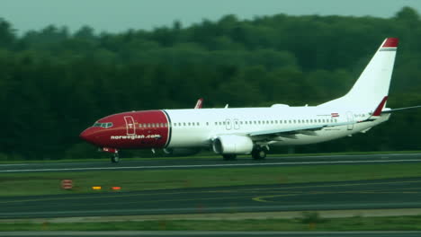 Norwegian-Airway-airplane-on-the-runway-about-to-take-off,-Establishing