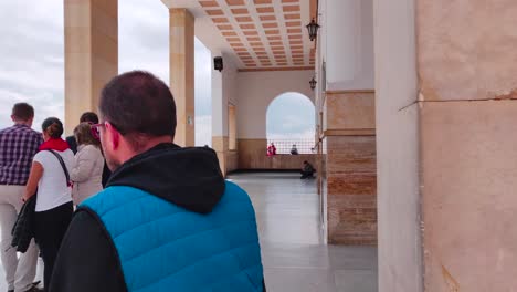 View-of-people-near-the-entrance-of-a-church-on-the-top-of-Monserrate-cable-car-in-Bogotá,-Colombia