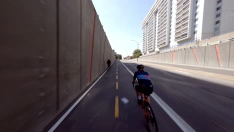 POV-Cycling-Along-Empty-Road-On-The-Reseau-Express-Velo-In-Montreal,-Canada