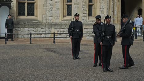 Guard-Officers-Observing-Around-English-Guards-Standing-Outside-Building-In-The-UK