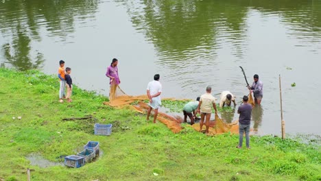 A-group-of-fishermen-setting-their-nets-at-river-bank