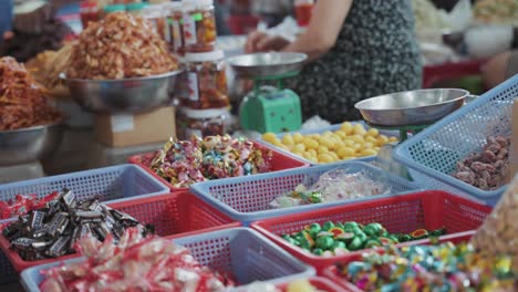 Local-vendors-and-traditional-stalls-sell-foods,-fruits,-vegetables,-sweets,-and-clothes-at-busy-and-colorful-Con-Market-in-Danang,-Vietnam