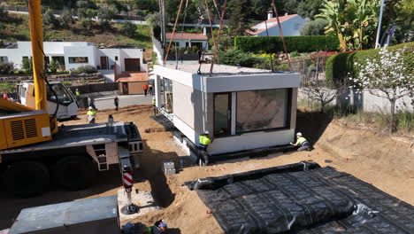 Prefabricated-house-module-resting-on-foundations