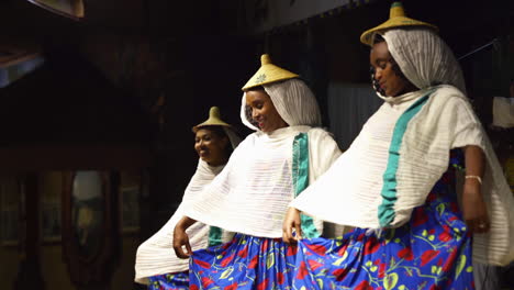 Girls-doing-a-traditional-dance-at-the-restaurant-Yod-Abyssinia-in-Addis-Abeba-Ethiopia-with-is-know-for-illustrating-all-cultures-of-Ethiopia-by-dancing-the-local-dances