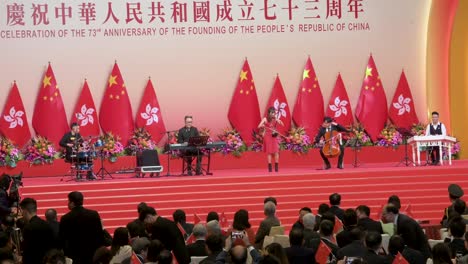 Una-Banda-De-Entretenimiento-Toca-Frente-A-Funcionarios-Del-Gobierno-E-Invitados-Pro-China.-Asisten-A-Una-Ceremonia-Que-Celebra-El-Día-Nacional-Y-El-Aniversario-De-China-El-1-De-Octubre.