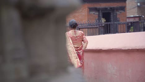 Track-Right-Shot-From-the-Back-of-Nepalese-Woman-Walking-away-Wearing-Traditional-clothes-,-Kathmandu-Nepal