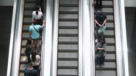 Chinese-shoppers-ride-on-automatic-moving-escalators-at-a-high-end-shopping-mall
