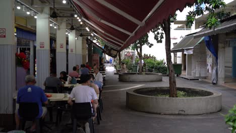 Scene-of-people-dining-and-chit-chatting-in-the-local-neighbourhood-coffee-shop-in-Whampoa,-Singapore