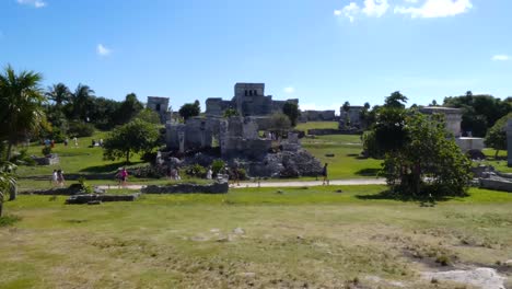 Templo-del-Dios-Descendente-left-up,The-Castle-center-up,The-House-of-the-Columns-and-Temple-of-the-Frescoes-at-Tulum-archeological-site,-Quintana-Roo,-Mexico