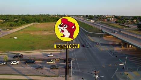 Aerial-footage-of-the-Buc-ee's-sign-in-Denton-Texas,-Located-at-2800-S-Interstate-35-E,-Denton,-TX-76210