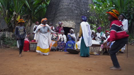 Ethiopian-Dorze-tribal-people-dancing-and-making-music-in-front-of-a-straw-hut-in-Dorze-Village-near-Arbaminch