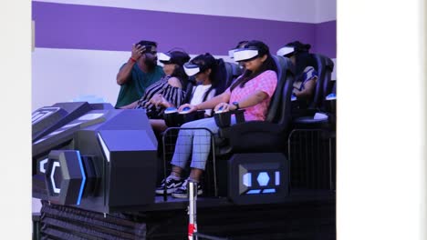 Group-of-people-enjoy-VR-video-experience-with-headsets-in-the-cinema-Colmar-Tropicale,-Bukit-Tinggi-Malaysia
