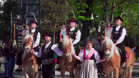 Fanfare-trumpets-being-played-during-the-annual-Haflinger-parade-taking-place-every-Easter-monday-in-Meran