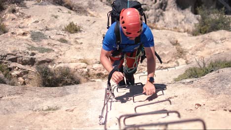 Redovan,-Spain,-May-7,-2023:-Via-ferrata-ascension-by-a-couple-sportsmen