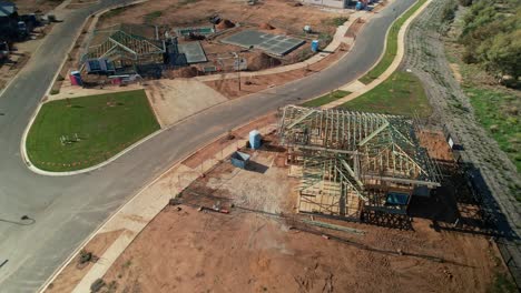 Yarrawonga,-Victoria,-Australia---14-May-2023:-Aerial-around-two-storey-house-under-construction-with-golf-course-in-background-at-Silverwoods-Estate-in-Yarrawonga-Victoria