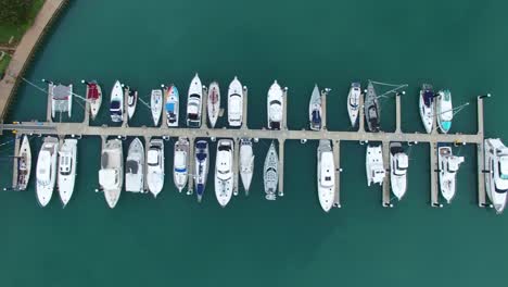 Aerial-float-over-boat-harbour,-Airlie-Beach,-Whitsundays,-Australia
